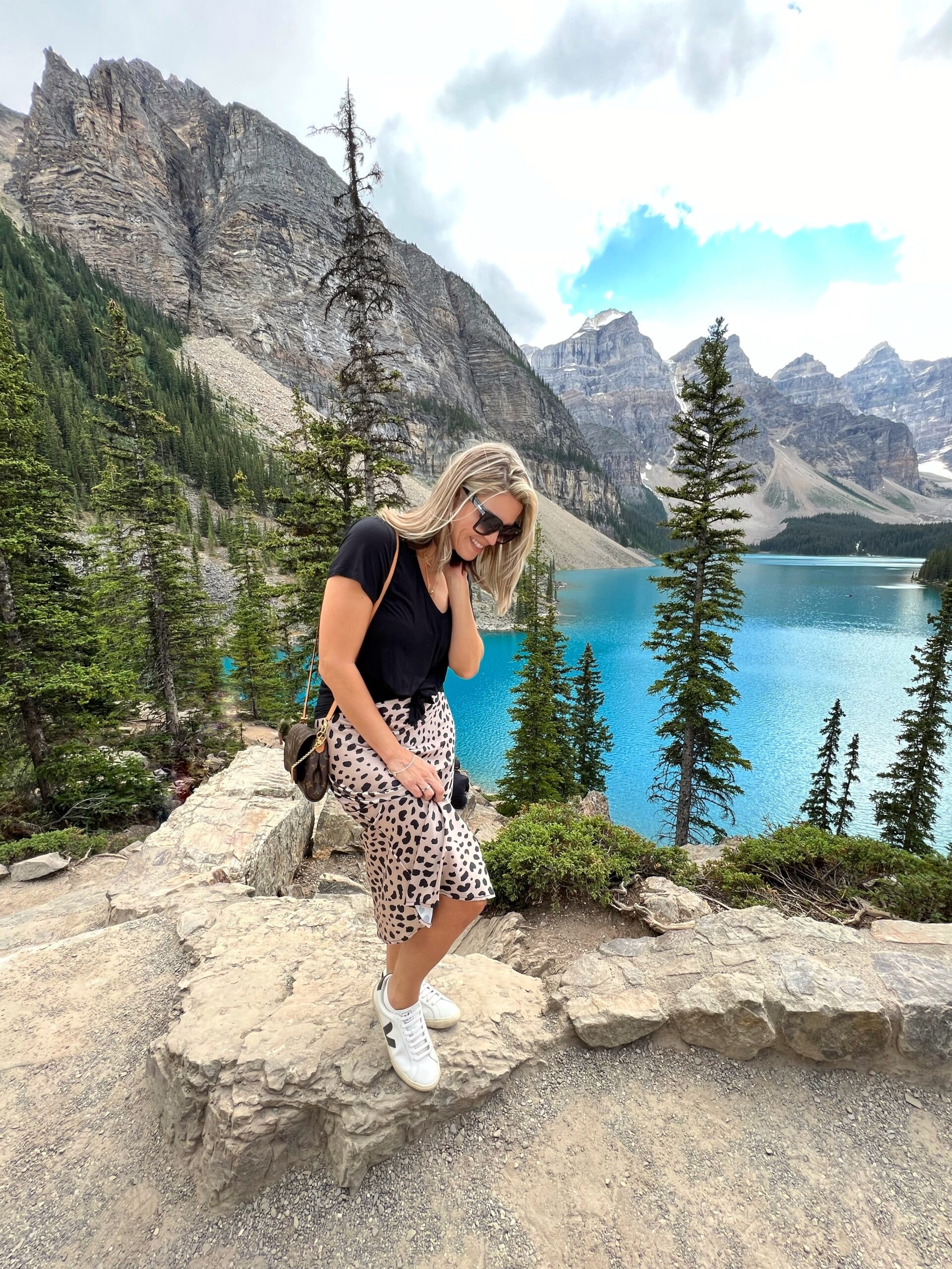Camila at Banff mountain lake in leopard print skirt